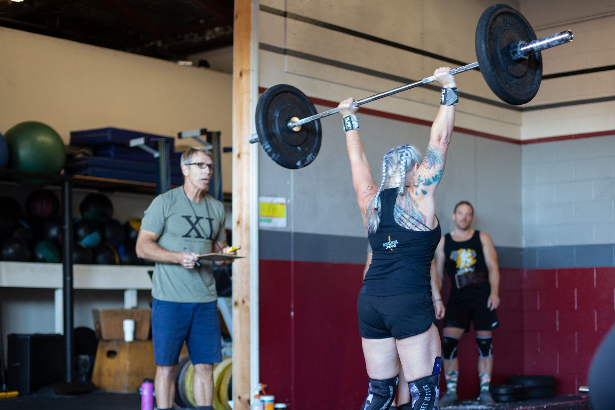 Angie Manson completes an overhead lift.