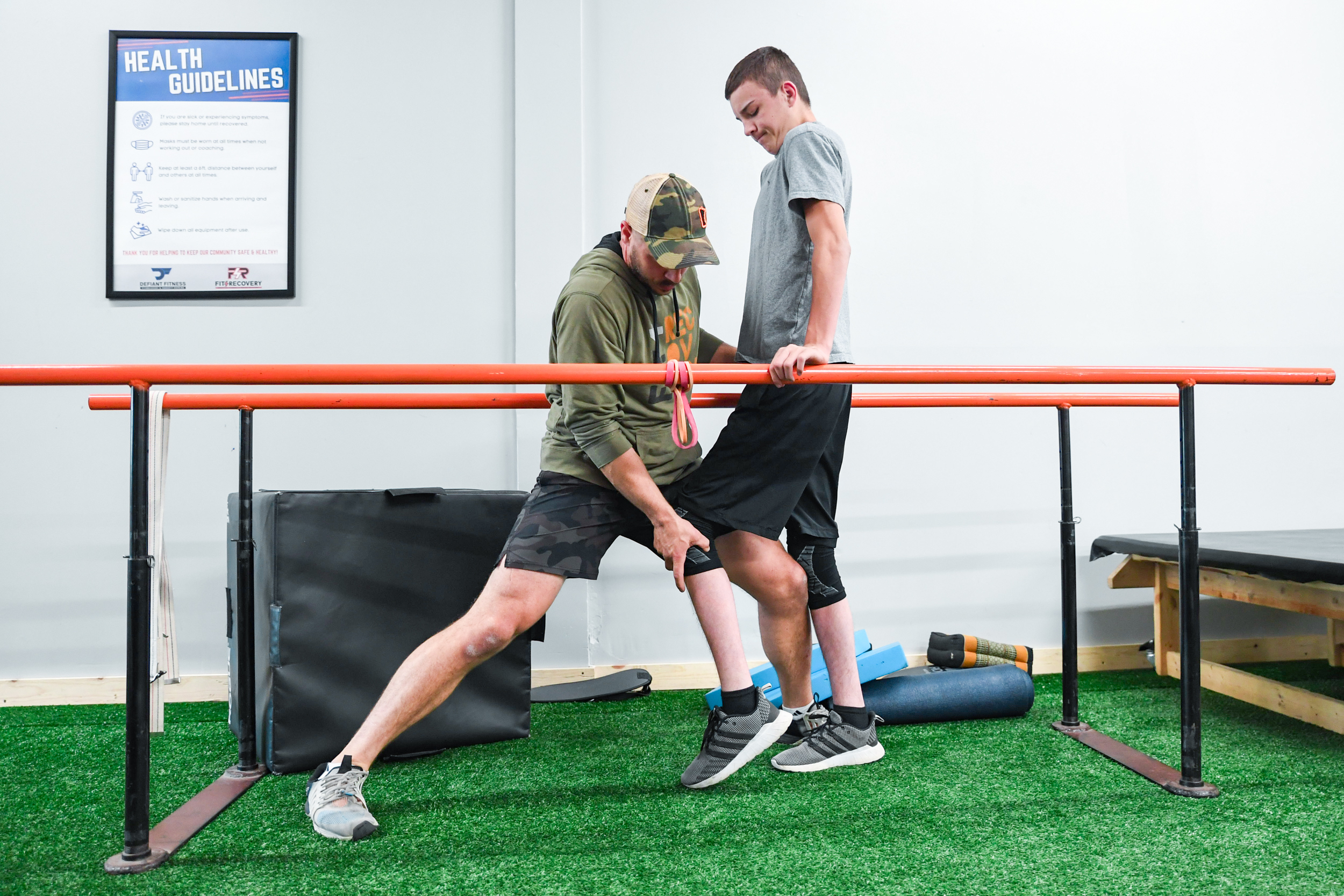 Raycer Frank walks for the first time since his injury with support from the parallel bars.