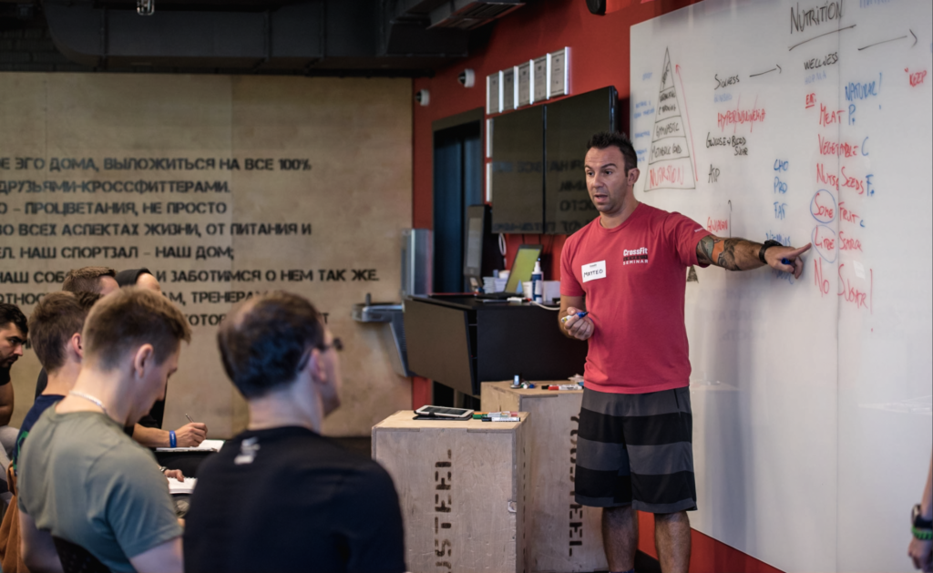 A CrossFit Seminar Staff trainer delivers a lecture on nutrition at a Level 1 Certificate Course.