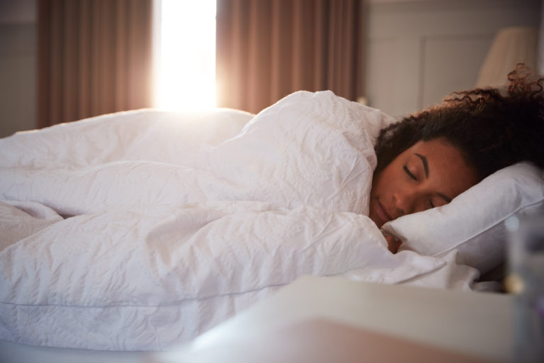 A woman asleep in bed