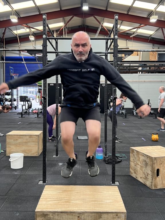 Scott Hanley does a box jump at CrossFit Belfast