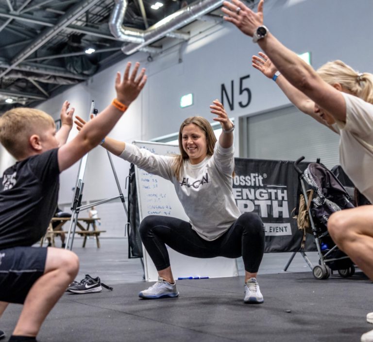 Two women and a child air squatting