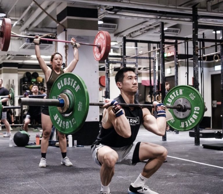 Athlete doing a thruster during Open Workout 24.3