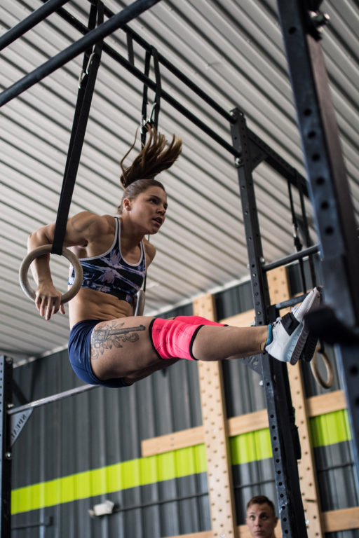 Sheila Barden performs muscle-ups for a CrossFit competition