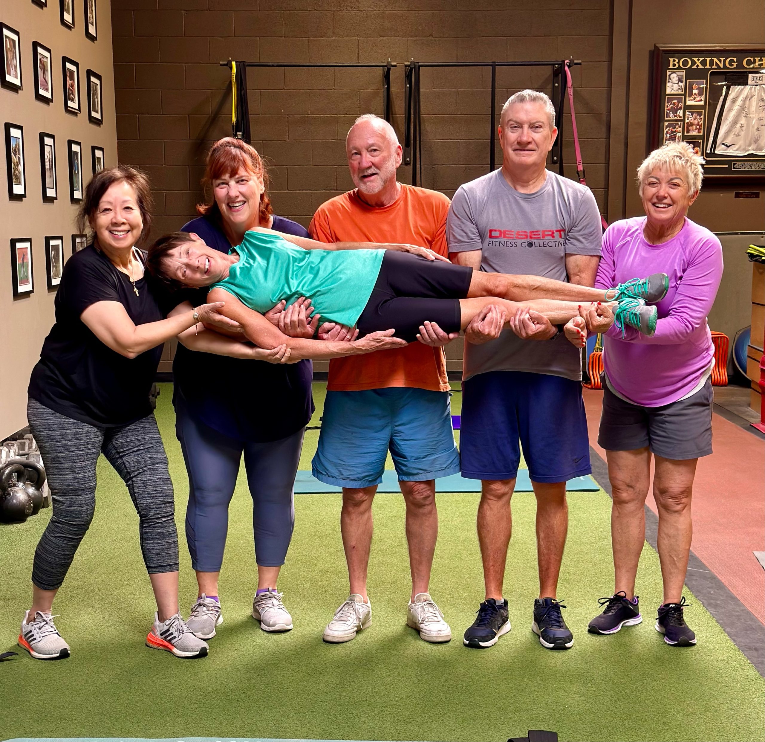 Senior athletes have fun posing for a photo at Desert CrossFit.