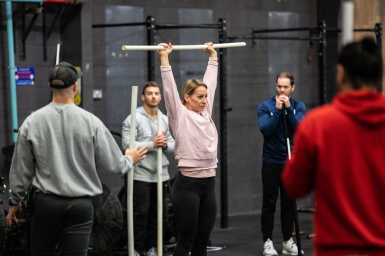Woman Pressing PVC Overhead
