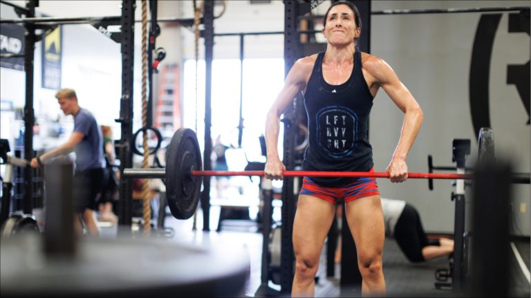 Woman doing hang power clean