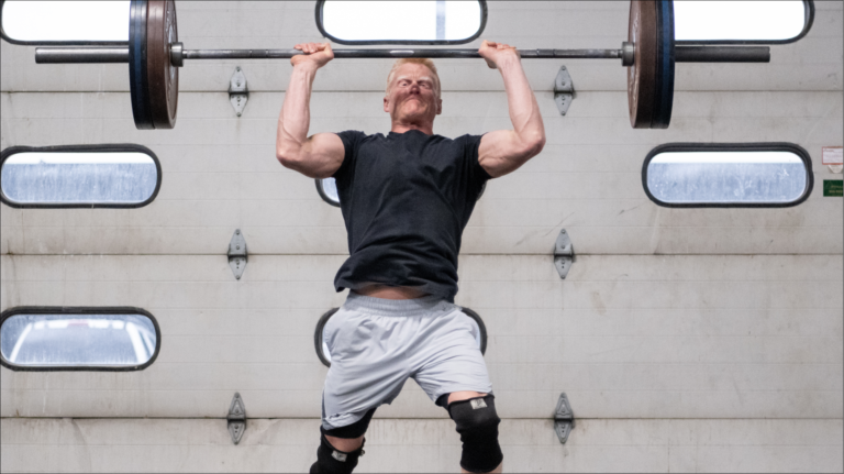 male doing power clean and push
