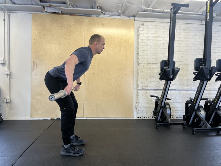 CrossFit athlete doing a Power Snatch Early Pull